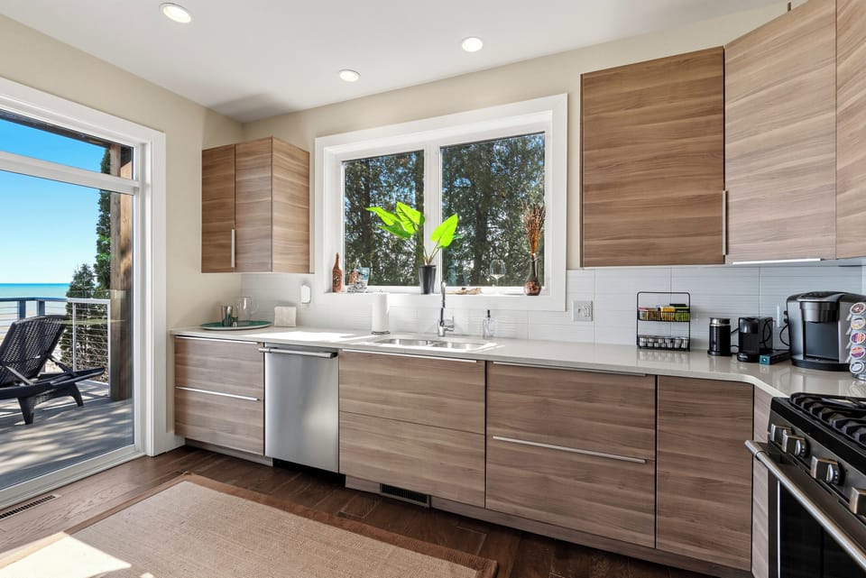 Fully equipped, modern kitchen with lake views. 