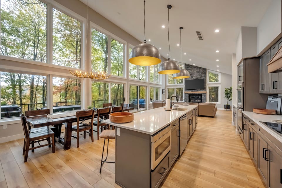 Dining area & kitchen island provide space for all 16 to share meals & laughter
