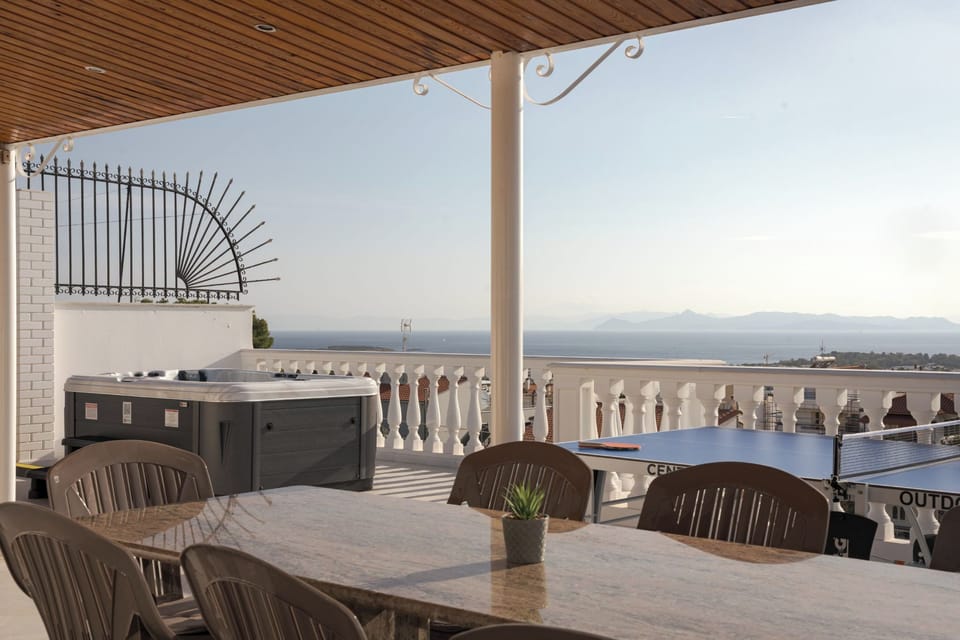 Outdoor Area with View and Private jacuzzi and Dining Table