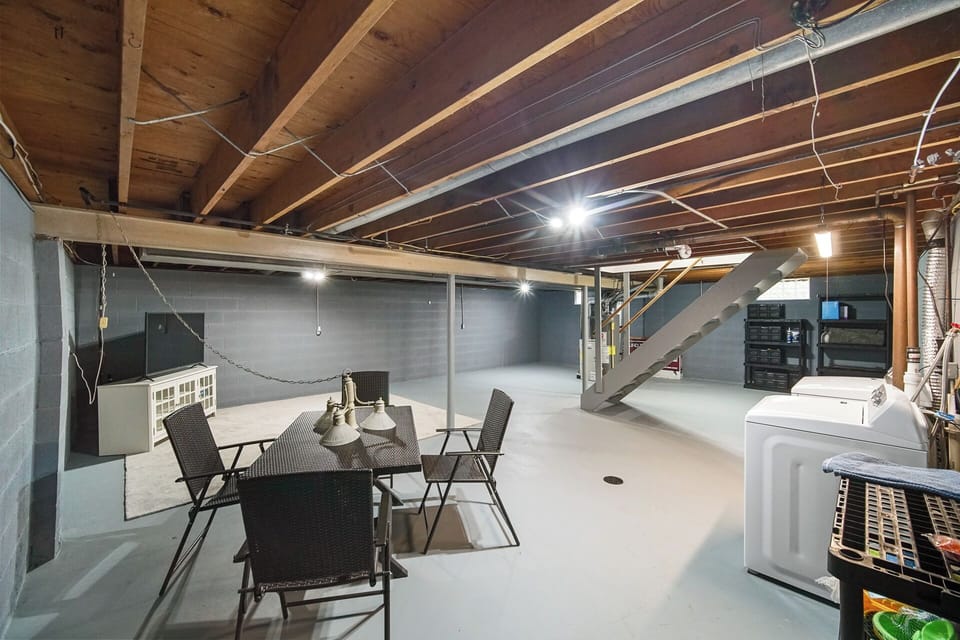 Basement with games, TV, Washer and Dryer