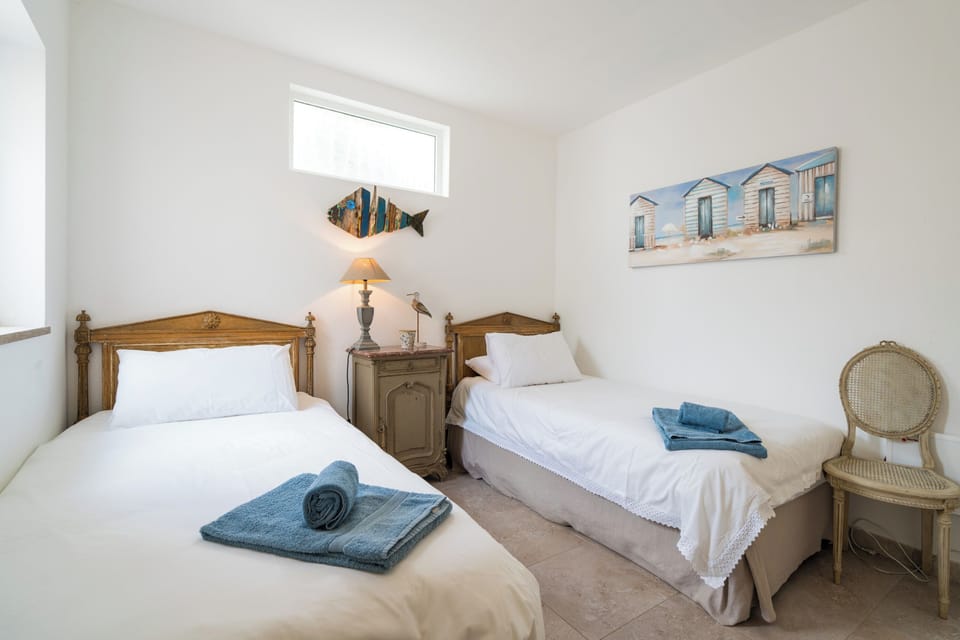 Bedroom 3 with 2 single beds and spacious wardrobe space.