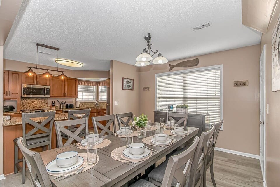 Gather 'round the table: Our spacious dining area comfortably seats 10, perfect for family feasts & friendly gatherings. Oh! We definitely have not forgotten your little ones! We have highchairs & a booster seat for them to enjoy meal time as well!