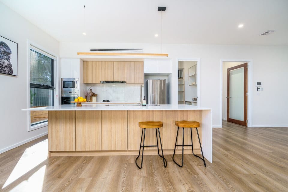 Step into culinary delight in this chic kitchen adorned with stainless steel appliances. Get ready to create cherished memories in this perfect cooking haven.