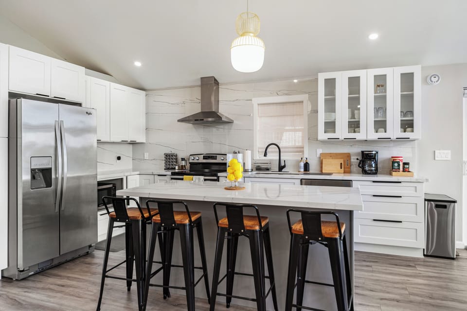 Fully equipped modern kitchen with stainless steel appliances