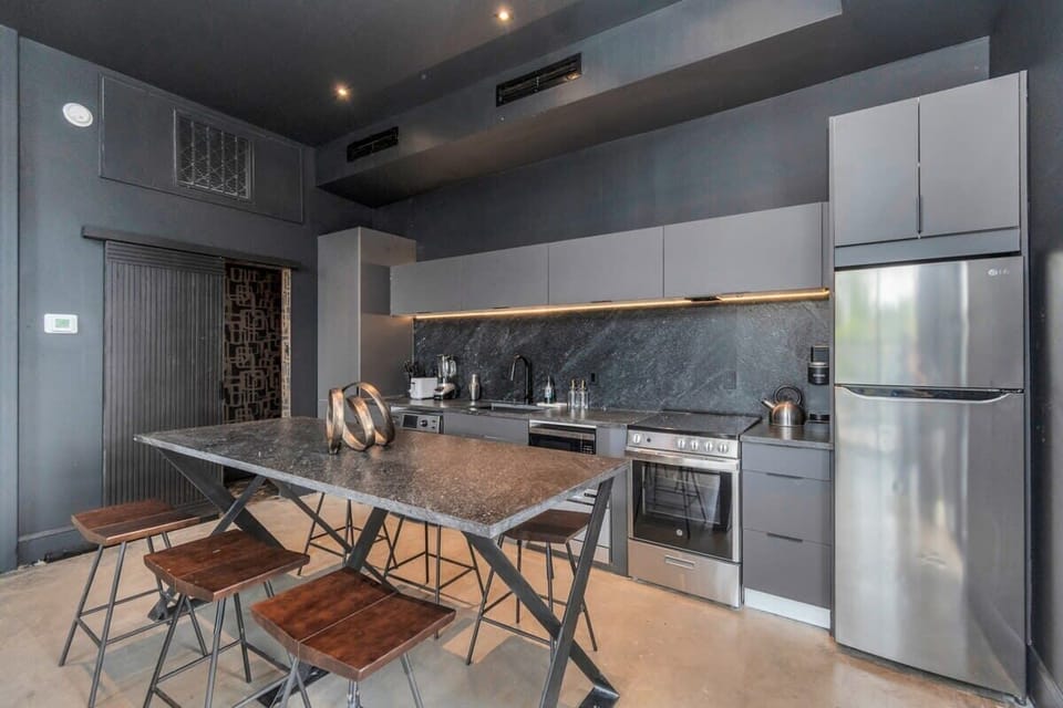 Modern Kitchen Design: Fully equipped with state-of-the-art appliances, ample counter space,