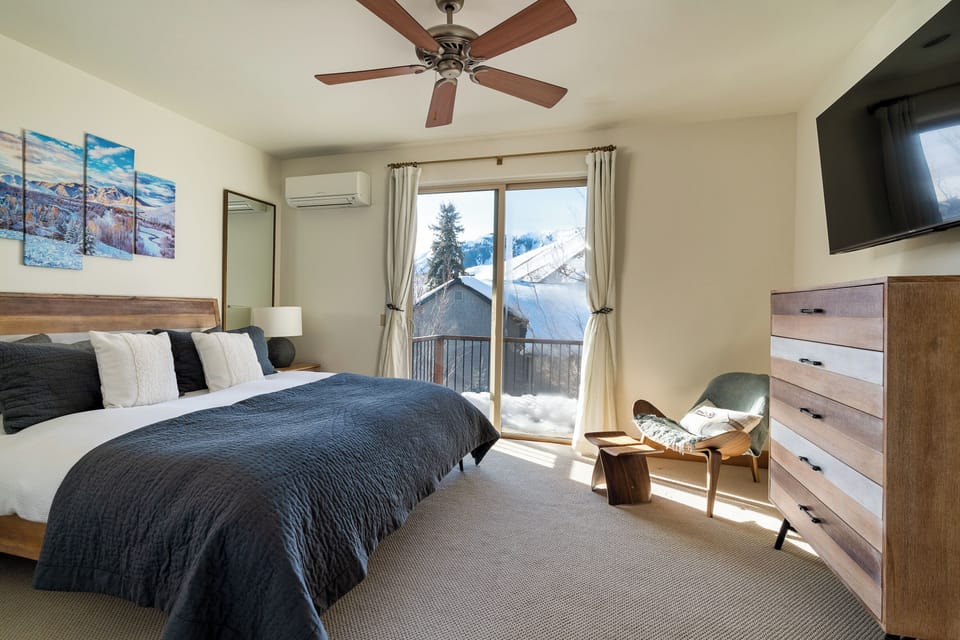 Master bedroom: luxury king mattress, 55 inch smart TV, AC unit, outdoor balcony