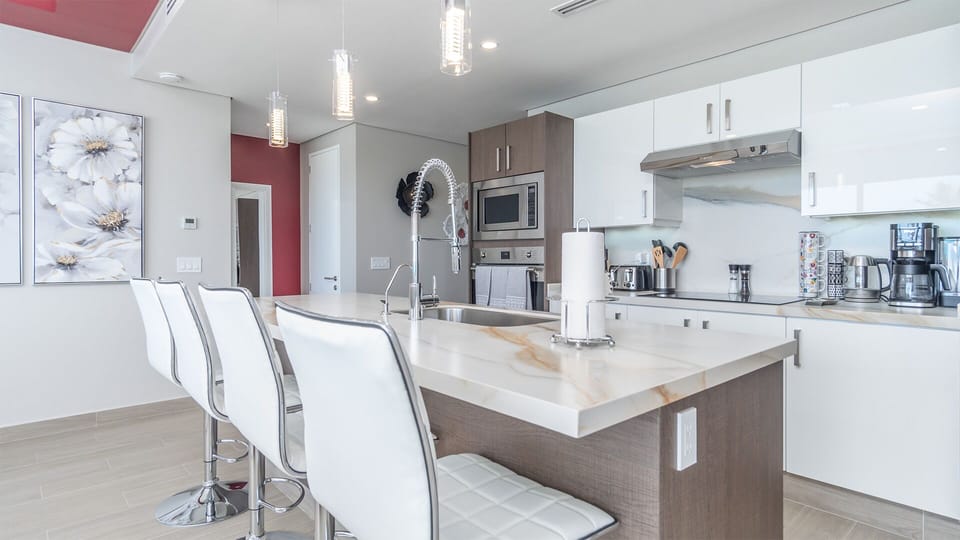 the kitchen is complete with appliances and cookware