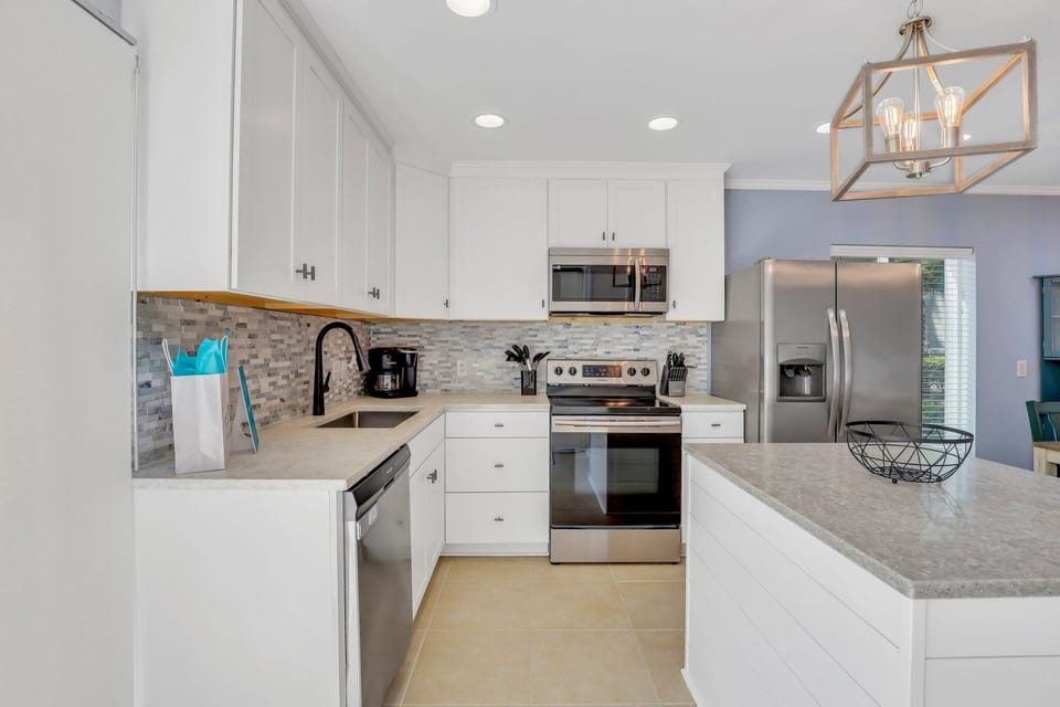 Fully stocked kitchen with stainless steel appliances
