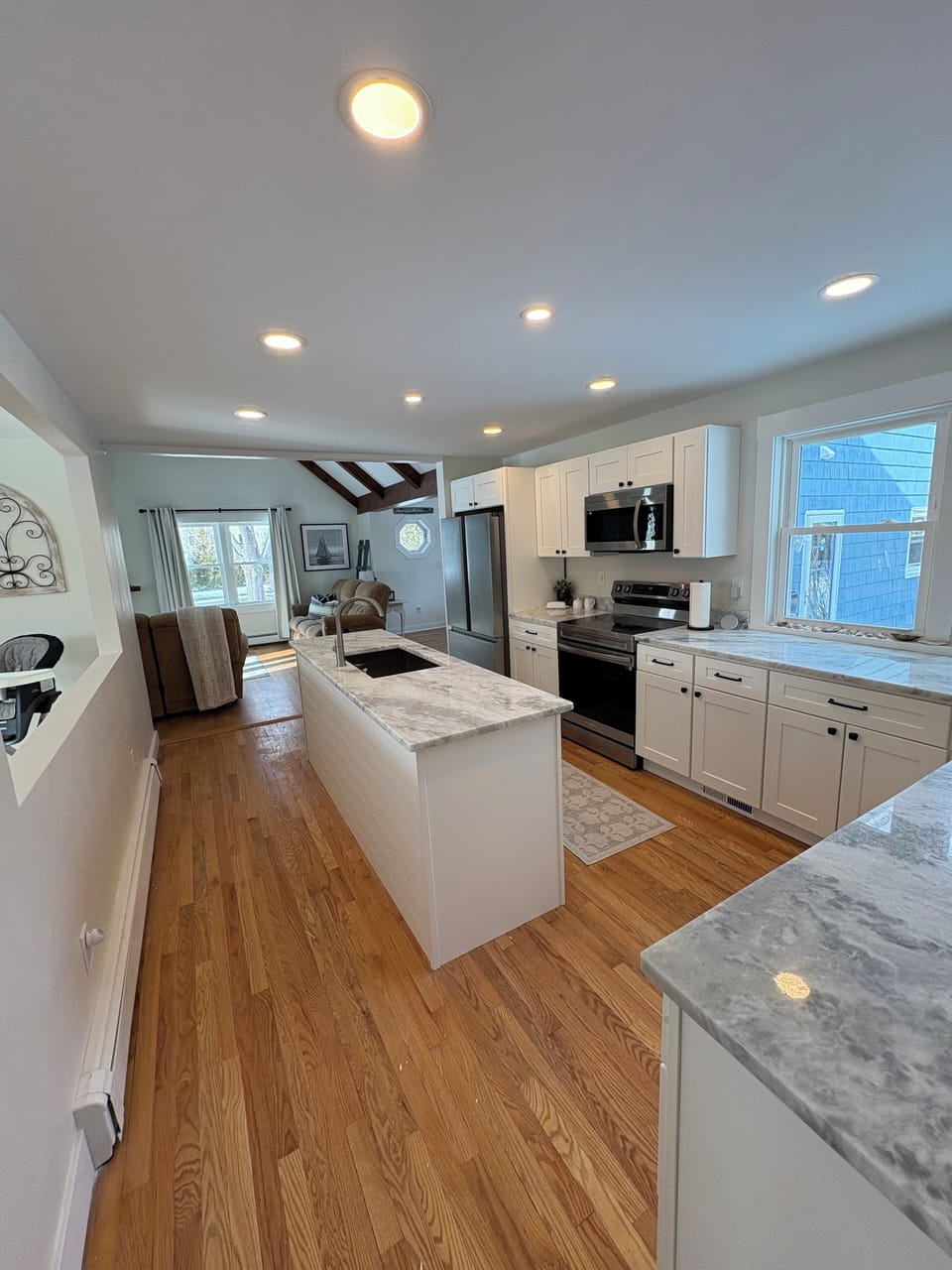 Fully equipped kitchen with stainless steel appliances and a DR look through
