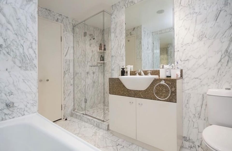 Marble bathroom with separate shower and bath
