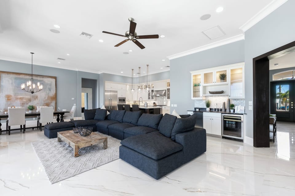 Relax on the modern sectional with stunning water views - the primary living area.