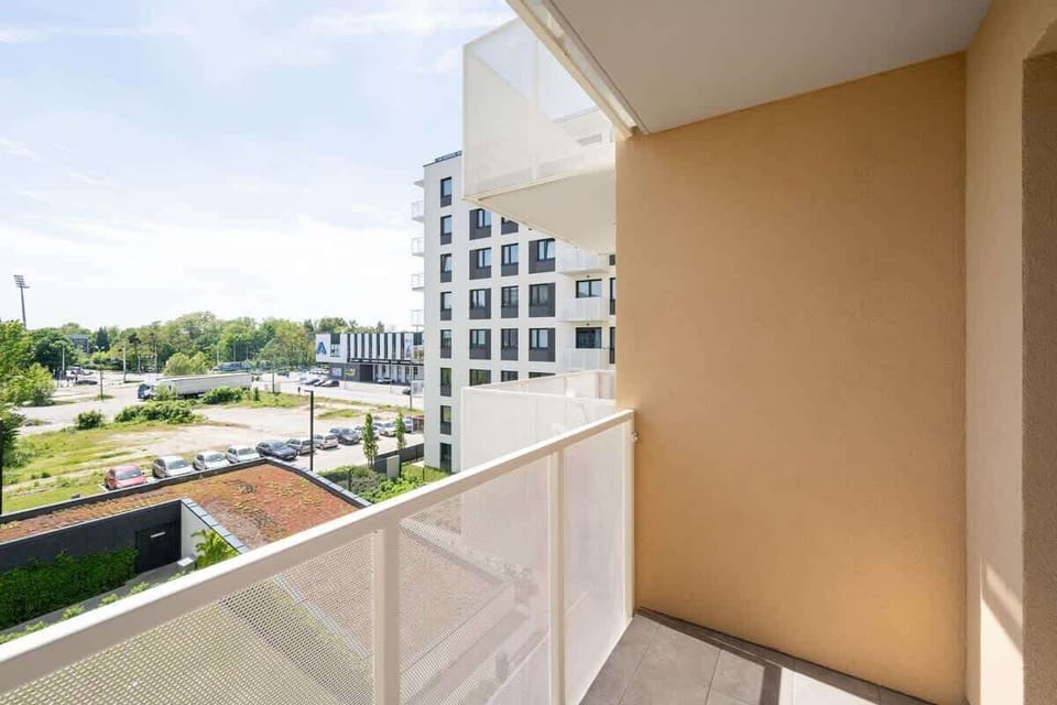 Balcony overlooking the housing estate and its surroundings.