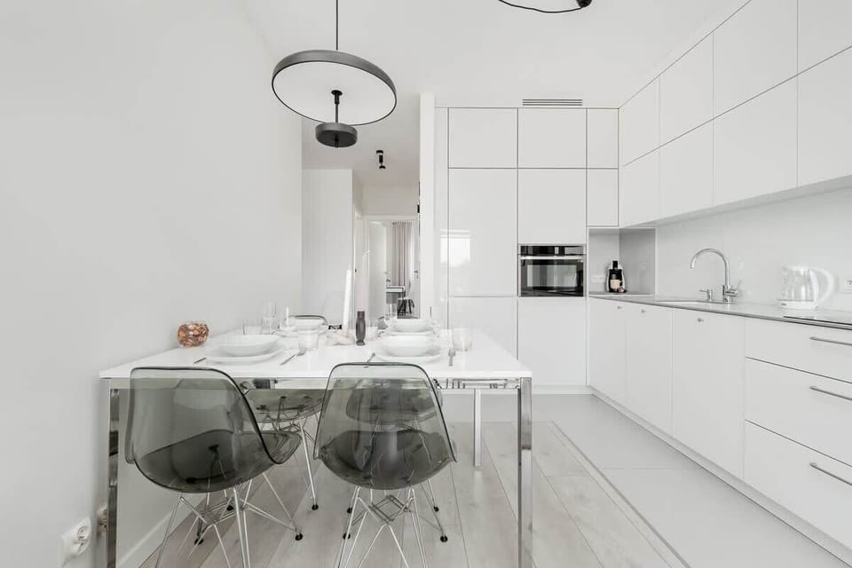 The fully equipped kitchenette features ample cabinet space and dining area.