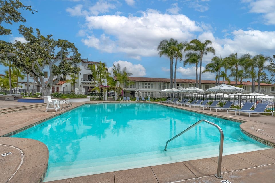 Situated in a lush garden setting, these two pools and hot tubs offer an oasis for relaxation.