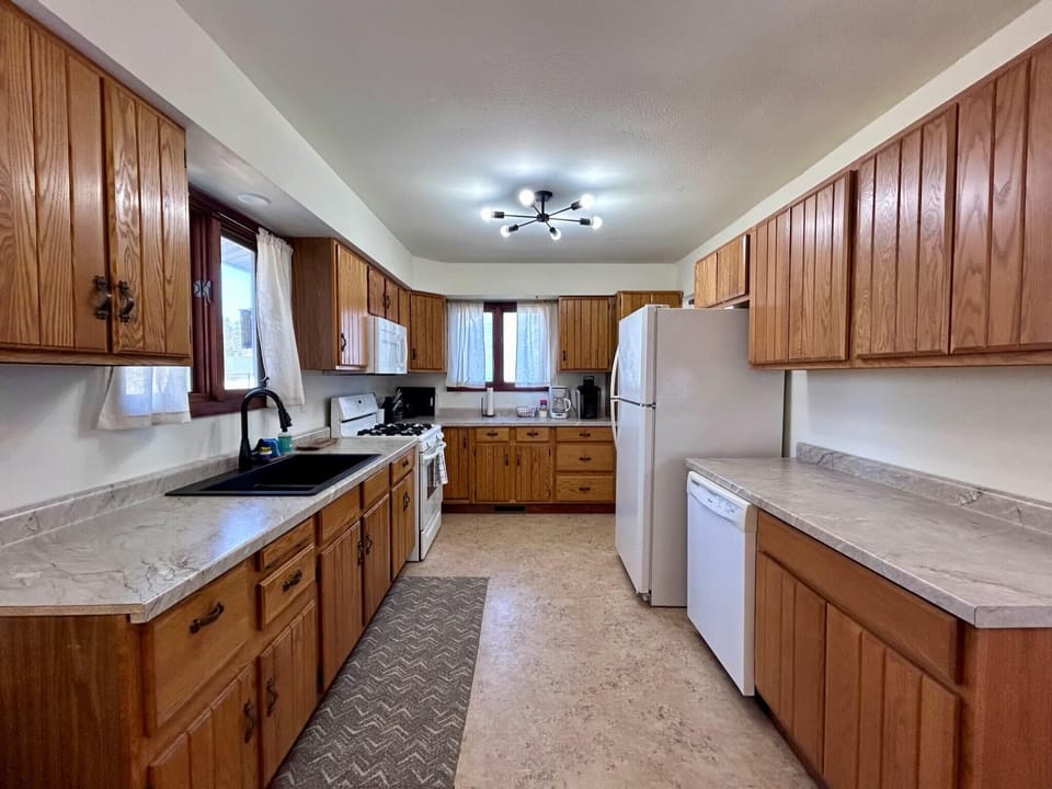 Large, fully stocked kitchen.