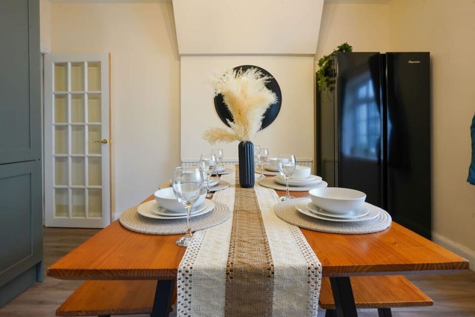 Large dining table and benches (stools available for larger groups)
