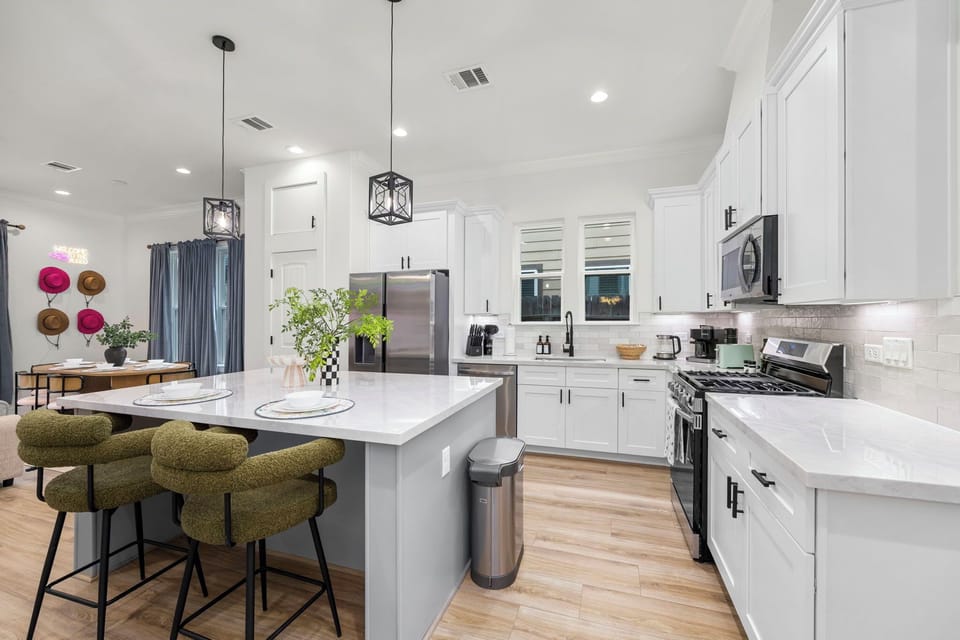 Spacious kitchen with all-white interior