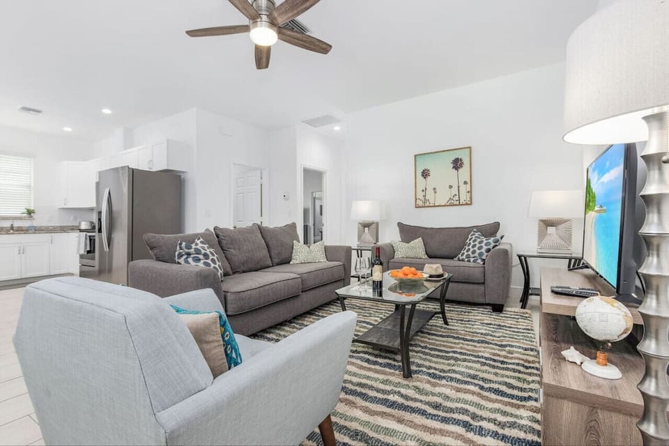 Contemporary casual open plan living, dining and kitchen area