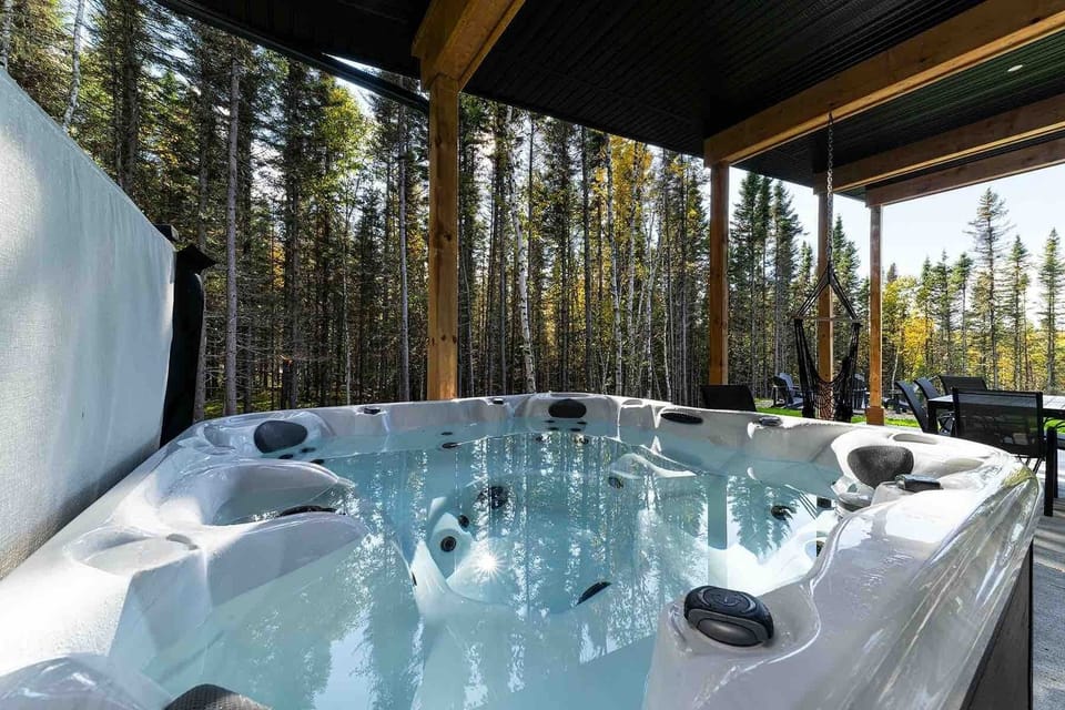 Starlit spa moments where the forest whispers and bubbles surround.