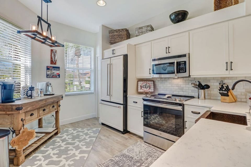 The kitchen is well equipped with family fridge/freezer, oven, stovetop, microwave, dishwasher, and most other small appliances you may need. There is even a well-stocked spice cupboard.