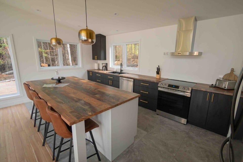 Whip up delicious meals in this bright, inviting, and airy kitchen space.