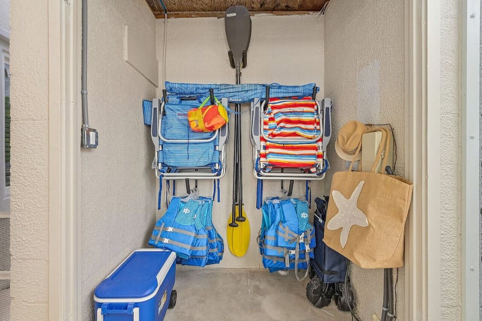 Beach gear! Provided for your use, chairs, a cooler, umbrella, and beach cart