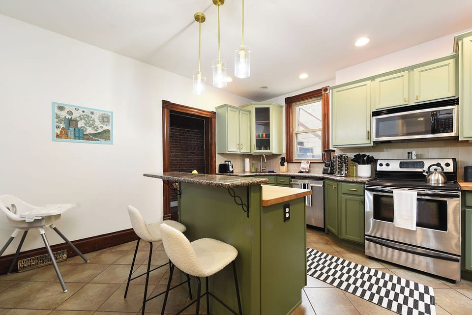 The kitchen island for 2 and high chair