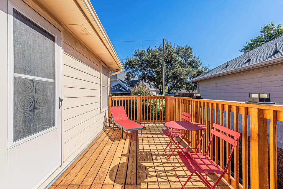 Private upstairs deck with outdoor seating and gas grill.