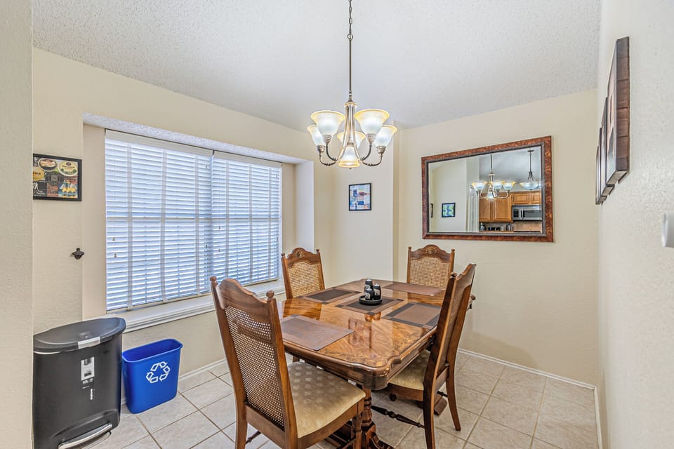 Dining table comfortably seats four, with two extra chairs available for six.