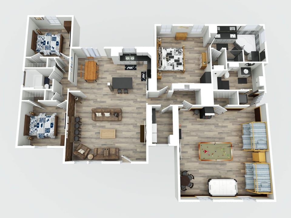 Open floor plan with a spacious living area, kitchen island, and a game room featuring a pool table and air hockey.