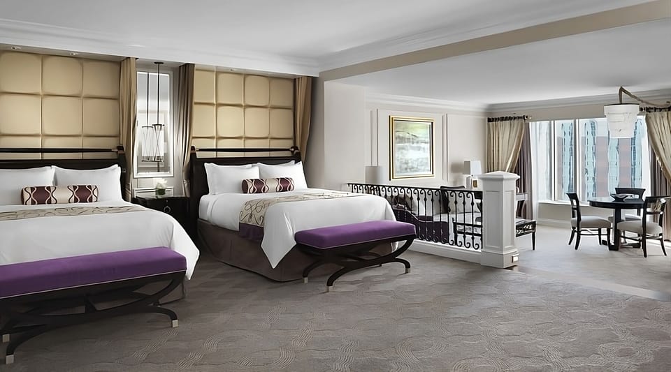 Unwind in a spacious suite with two plush queen beds.