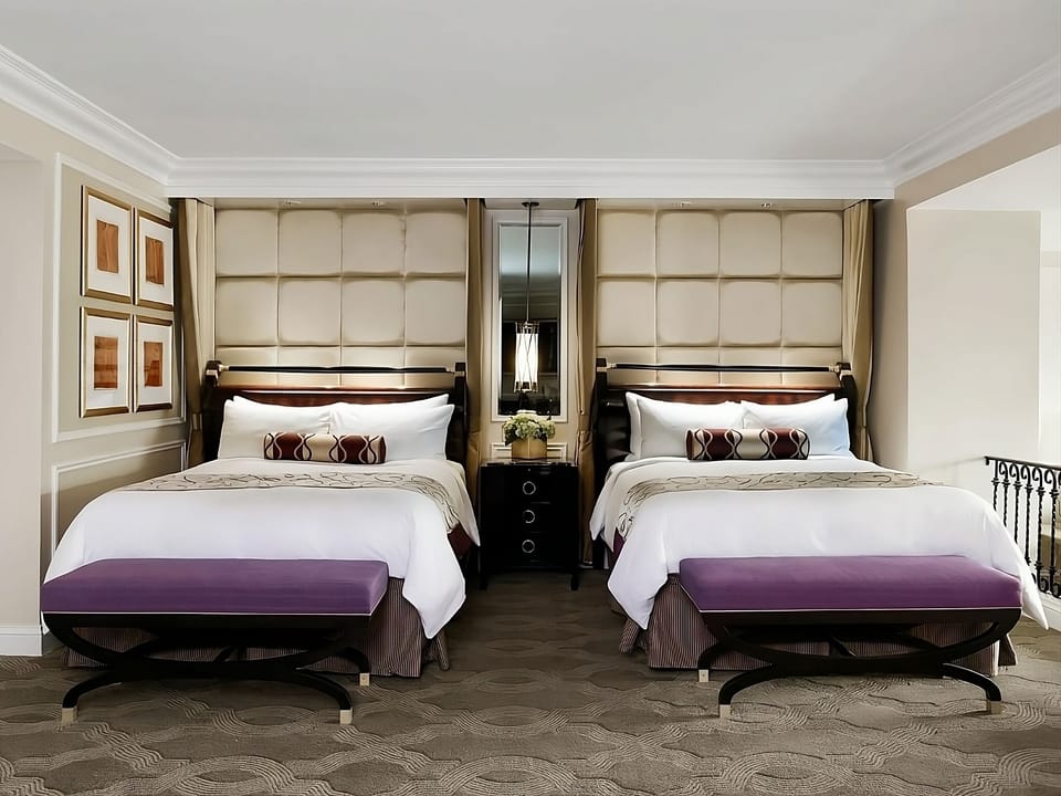 Settle into two luxe beds with elegant, quiet surroundings.