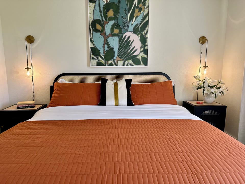 Gorgeaus primary bedroom with views. You may just want to stay in bed all day.