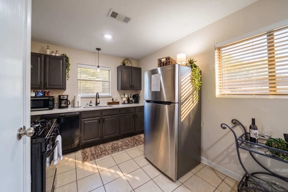 Kitchen: Whip up gourmet meals in this spacious kitchen with modern appliances and charming decor!