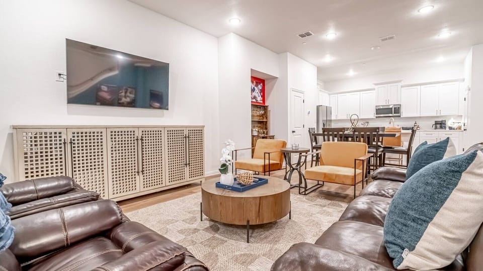 Kick back in a stylish, open-concept living space designed for comfort and connection. Whether you're debriefing after a Rangers game, watching pre-game coverage on the smart TV or just relaxing with your crew—The Ryan's living area has you covered.