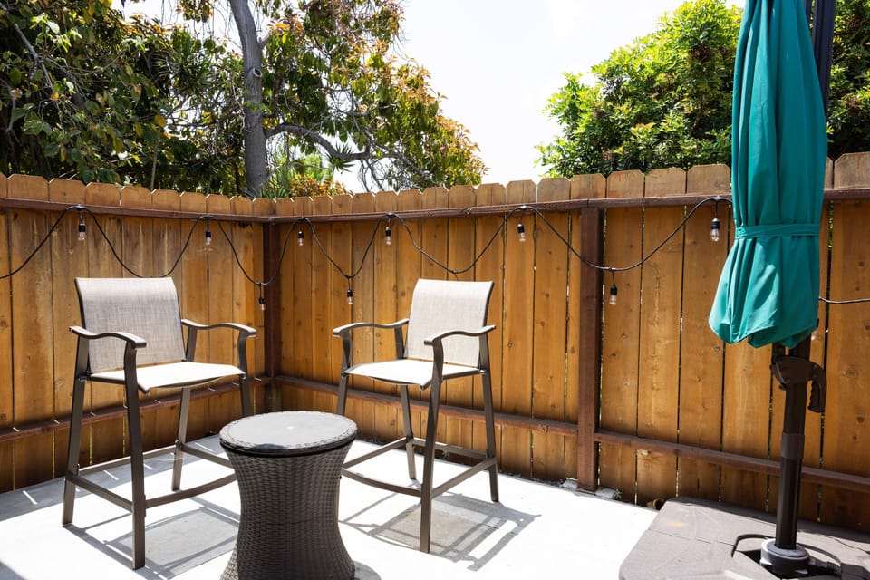 Front patio connected to the living room. Turn on the string of lights for a beautiful evening vibe.