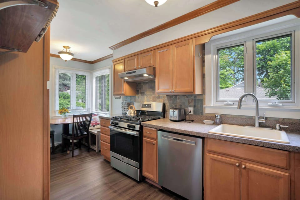 Kitchen with stainless steel appliances and breakfast bar