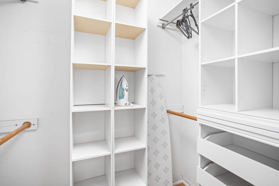 Discover convenience and organization in our closet, complete with an iron, ironing board, and hangers for your use.