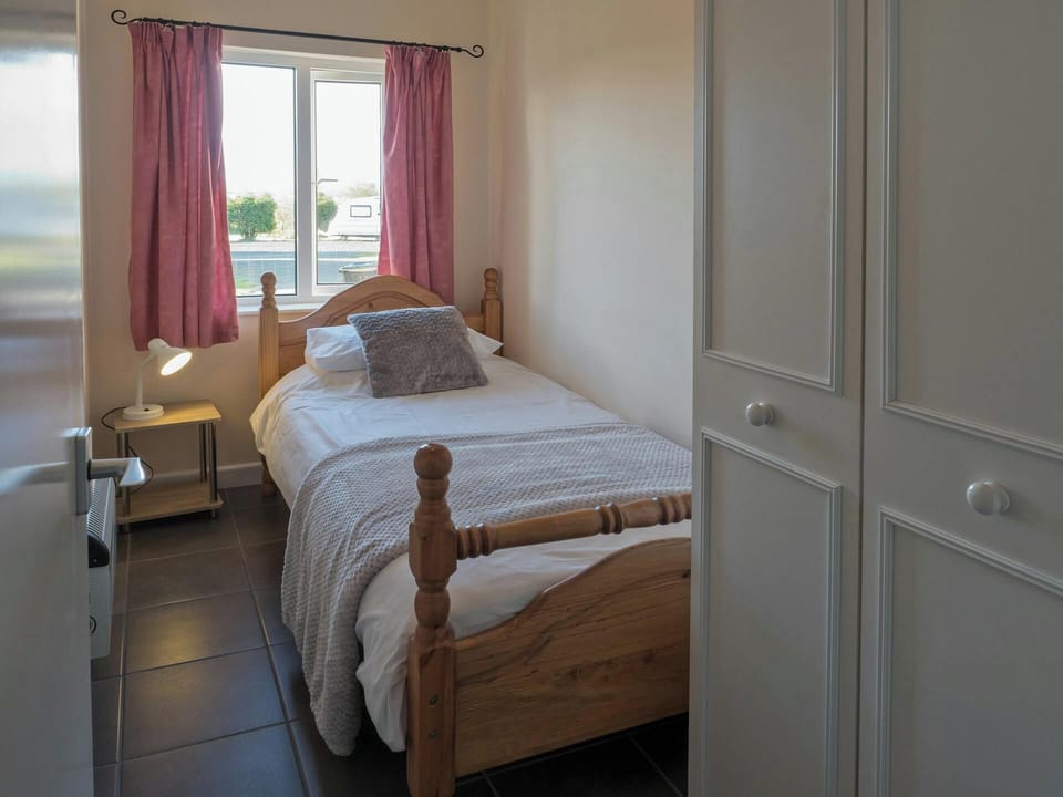 Single bed, bedside cabinet and lamp, wardrobe