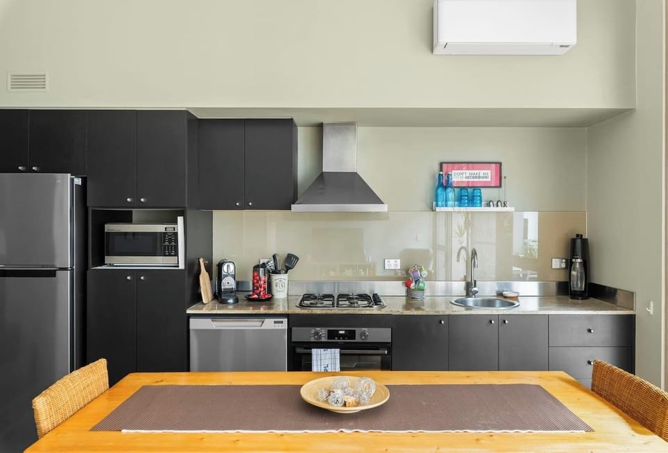 The kitchen has everything you need to whip up your favourite meals, with contemporary appliances such as a four-burner stove, rangehood, dishwasher, oven and fridge. 

