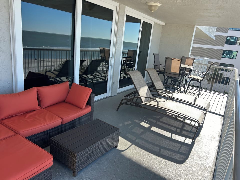 Oversized balcony has plenty of seating with sliders to master and livingroom