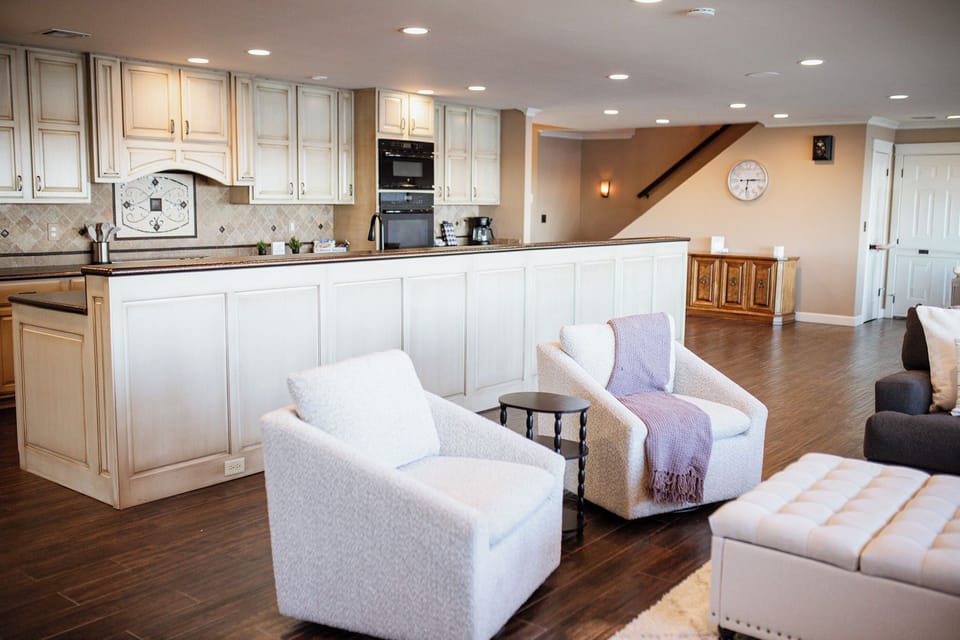 Living room with oversized TV and new furniture with plenty of seating and views galore!