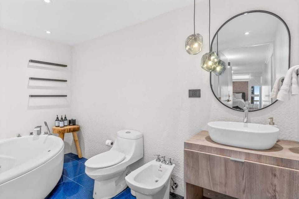 The soothing embrace of hot water fills the tub, creating an inviting atmosphere that encourages relaxation and tranquility.