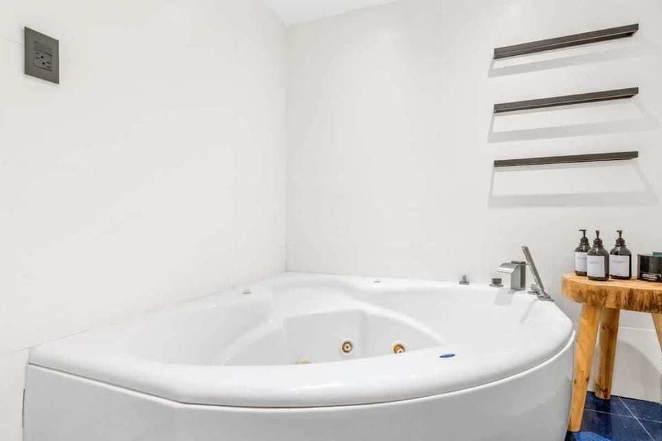 After a long and exhausting day, the bathroom transforms into a serene oasis, offering a much-needed retreat.