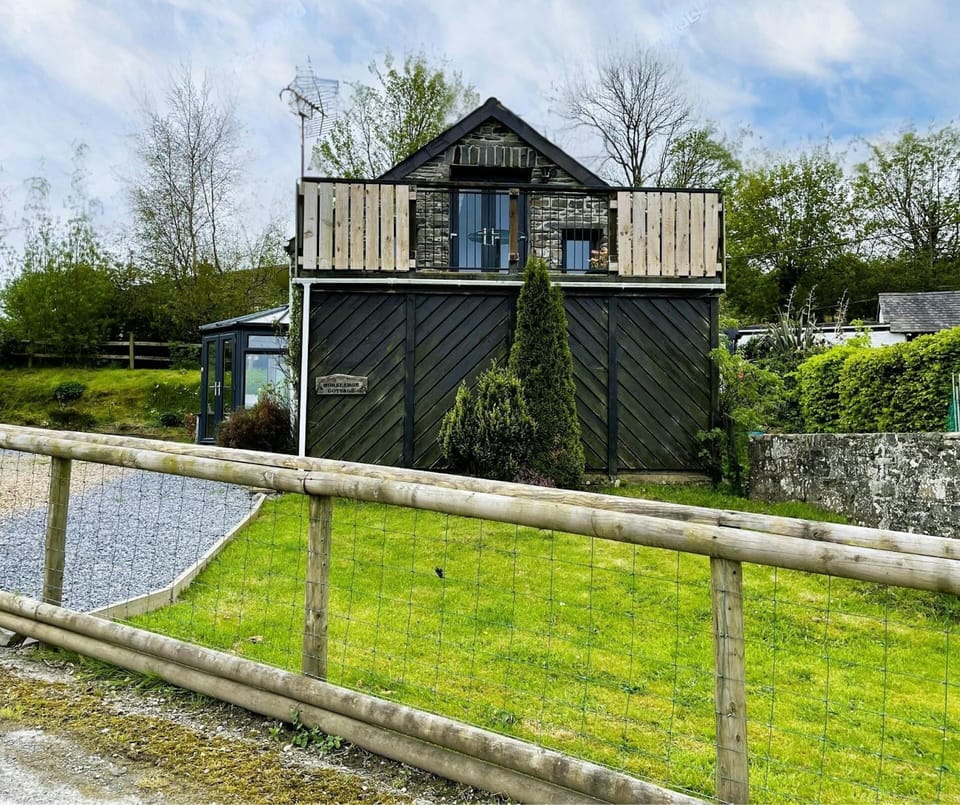 exterior image of property showing enclosed fence