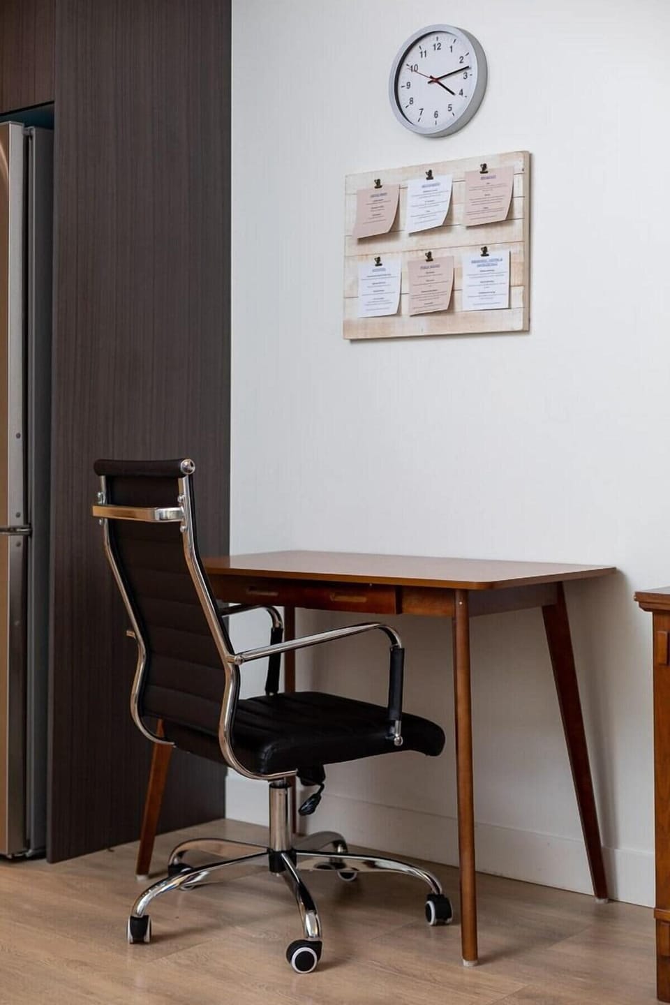 Stay productive on the go at this dedicated office desk and chair setup, complete with local wall decor.