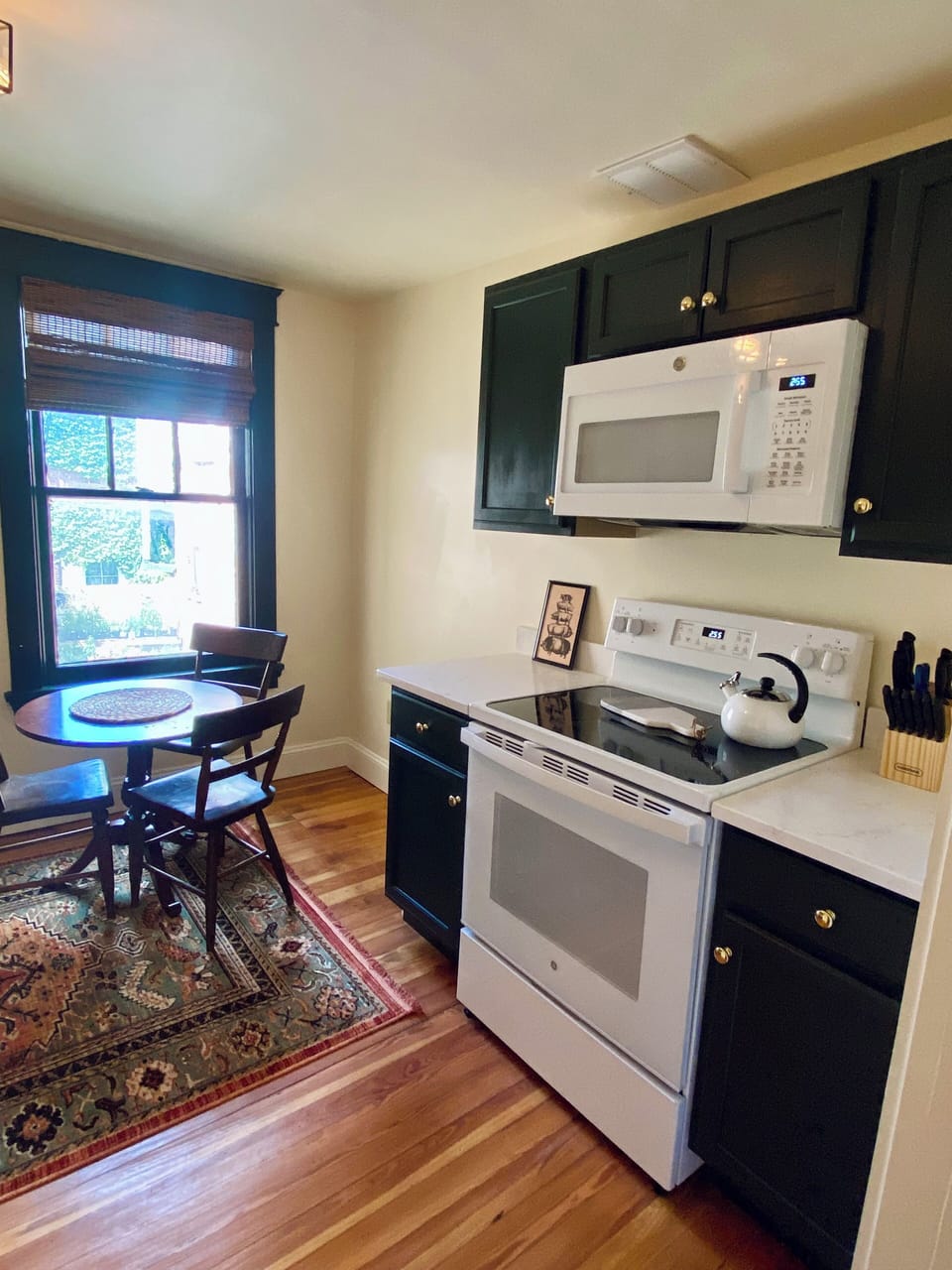 Kitchen overlooking courtyard with sitting breakfast table.
