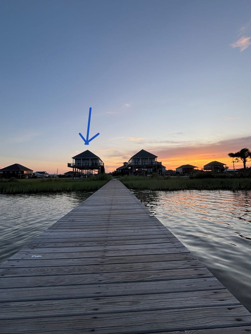 Watch the sun setting behind the camp from the dock.