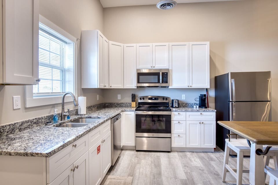 Chic Fully furnished Kitchen with Oven, Stove, Microwave, Refrigerator, Freezer, Keurig Coffee, in Biloxi, MS. A short drive from Gulfport, MS and Ocean Springs, MS