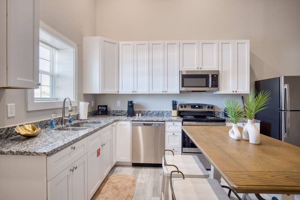 Chic Fully furnished Kitchen with Oven, Stove, Microwave, Refrigerator, Freezer, Keurig Coffee, in Biloxi, MS. A short drive from Gulfport, MS and Ocean Springs, MS